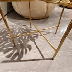 Sculptural Round Glass Sofa Side Table with Gold-Finished Leaf Detail and Textured Metal Frame